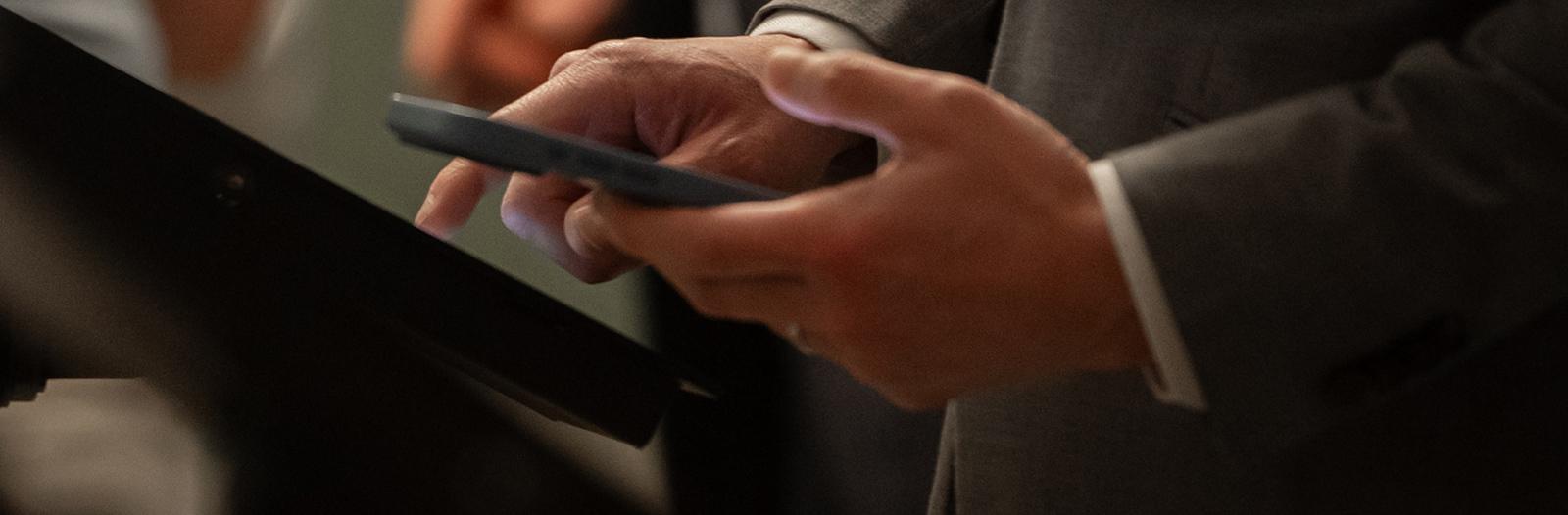 Closeup of business professional holding a mobile phone